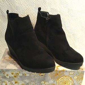 Black wedge booties.
